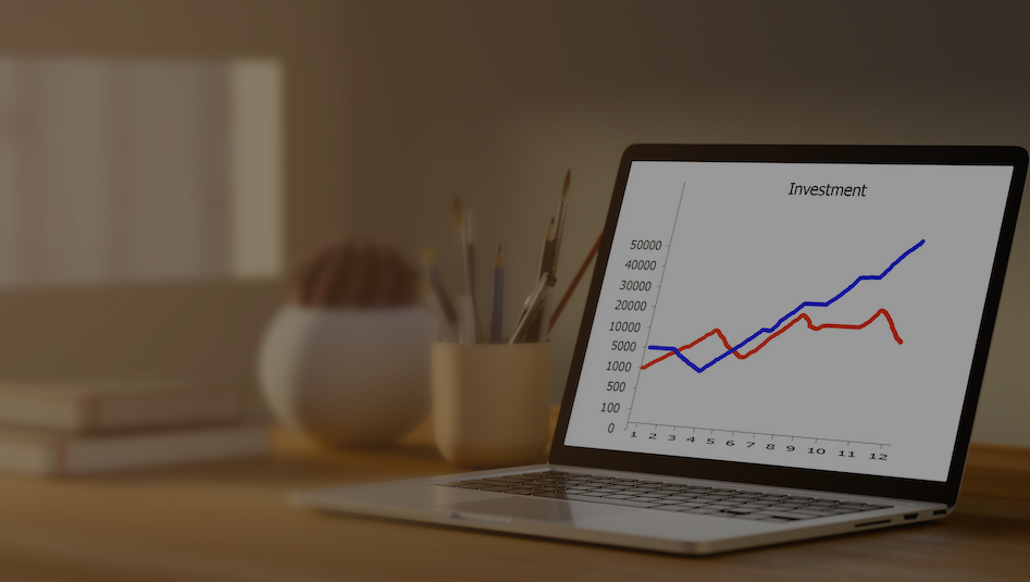 Investment,Charts,With,Laptop,On,The,Morning.