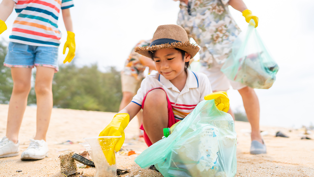 A group of people picking up trash